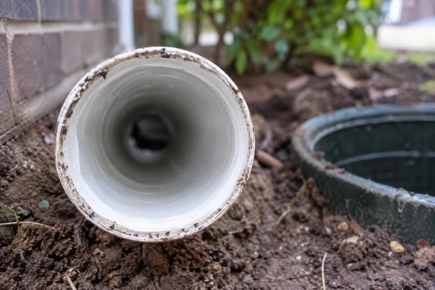 Relined drain pipe viewed through its circular opening